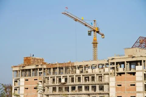 Crane and workers at construction Stock Photos