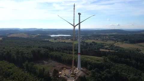 Crane assembling blades on a wind generator in Germany. Video stock 73123522