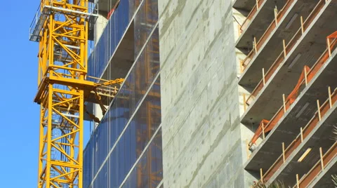 Crane attached to a building Vídeos de archivo 64701131