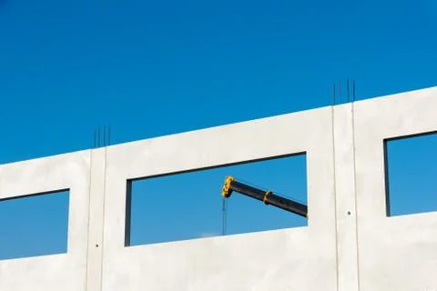 A crane behind a window of the modular building Stock Photos