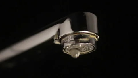 Crane on a black background with a drop Stock Footage 101599891