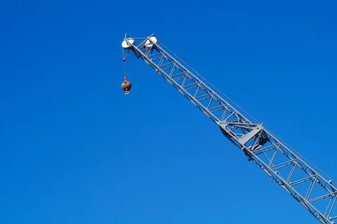Crane on blue sky hook lifting equipment construction industry Stock Photos