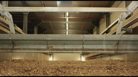 Crane Bridge Above Concrete Wall Over Wood Chip Bed, Fuel Bunker, Low Angle Shot Stock Footage 341436519