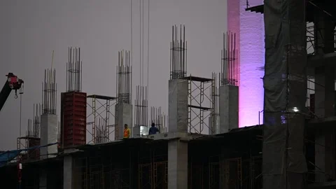 Crane bucket lifts material at Samut Prakan construction site Stock Footage 339875693