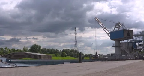 Crane bucket unloads raw material from an inland ship Stock Footage 65300068