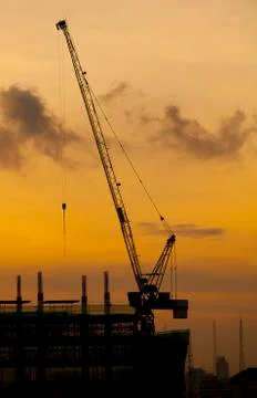 Crane of building construction on dusky sky 写真素材