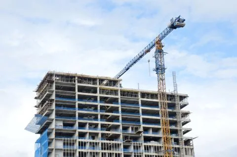 Crane on a building in construction 库存照片