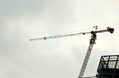 Crane on a building in construction Stock Photos