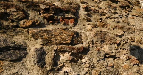 Crane camera shot of a stone medieval tower opens from the stone wall.low angle Stock Footage 118546620