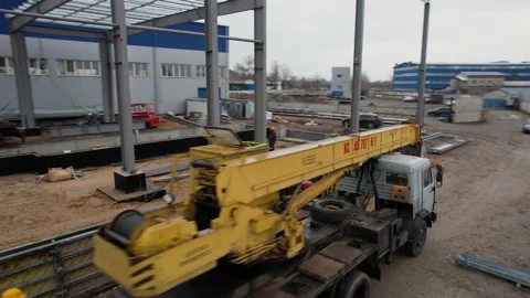 Crane car goes to the construction site of the frame meal roof Stock Footage 172129355