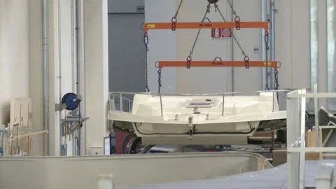 Crane carries main deck of a small boat Stock Footage 72143677