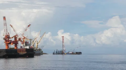 Crane on the coast is busy working 動画素材 153744338