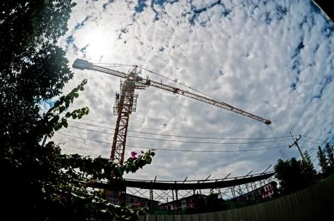 Crane in construction with blue sky Stock Photos