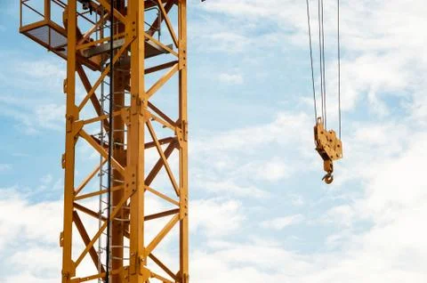 Crane in construction with blue sky Stock Photos