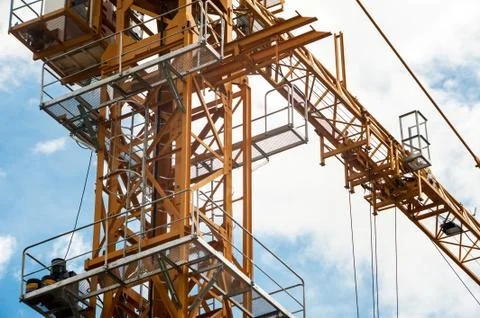 Crane in construction with blue sky Stock Photos