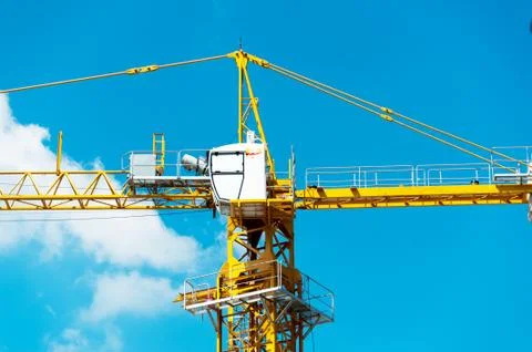 Crane in construction with blue sky Stock Photos