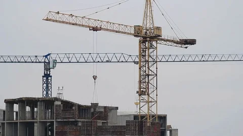  Crane at a construction site and workers Stock Footage 70020774