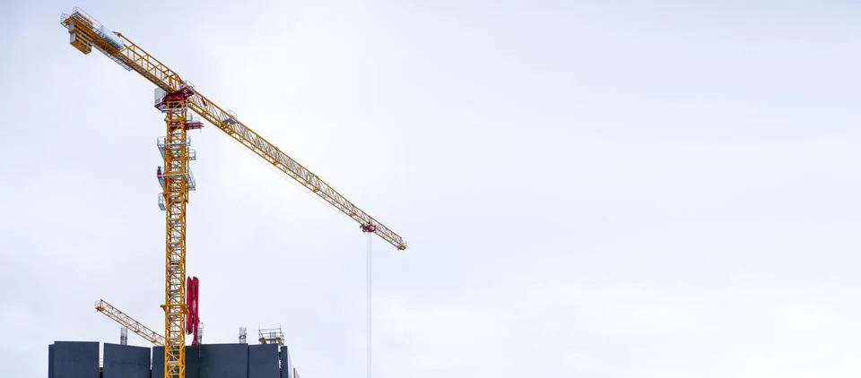 Crane on construction site background. Stock Photos