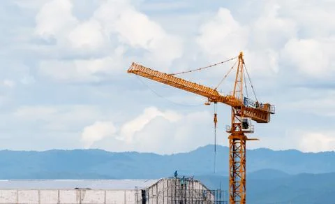 Crane in construction site building Stock Photos