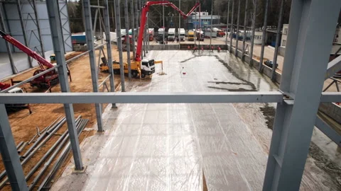 Crane at the construction site. Construction of a new warehouse quadcopter view Stock Footage 98789743