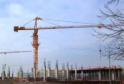 Crane on the construction site Stock Photos