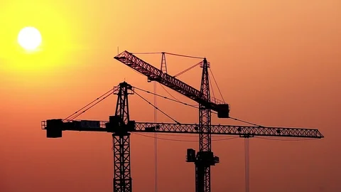 Crane construction site at sunset  库存影片 124378397