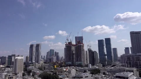 Crane construction work, View of Tel Aviv, Crane in motion Stockbeeldmateriaal 196972836