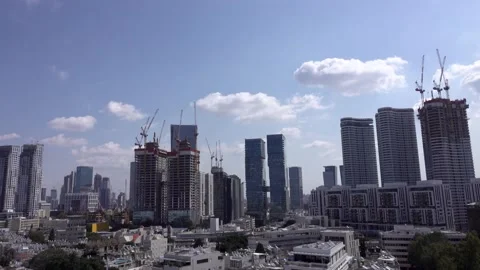 Crane construction work, View of Tel Aviv, Crane in motion Stockbeeldmateriaal 196973318