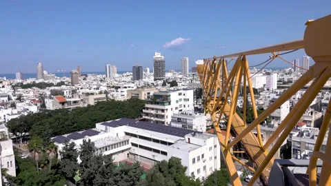 Crane construction work, View of Tel Aviv, Crane in motion Stockbeeldmateriaal 196973663