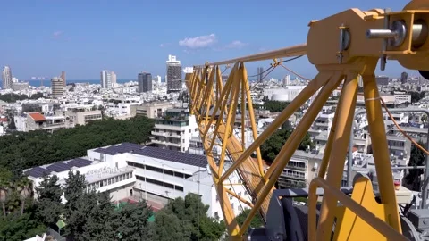 Crane construction work, View of Tel Aviv, Crane in motion Stockbeeldmateriaal 196973681
