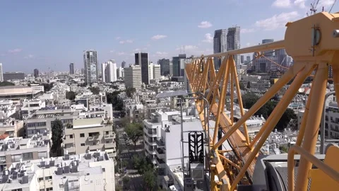 Crane construction work, View of Tel Aviv, Crane in motion Vidéo 196976189