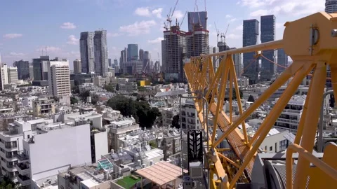 Crane construction work, View of Tel Aviv, Crane in motion Vidéo 196977990