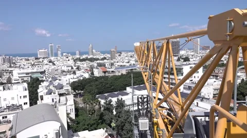 Crane construction work, View of Tel Aviv, Crane in motion Vidéo 196978262