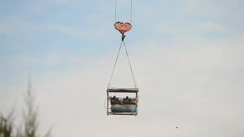 Crane with container on blue sky, construction area diversity, Stock Footage 89817470