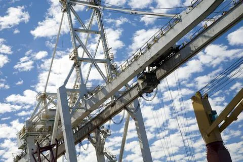 Crane in container terminal at a harbor Stock Photos