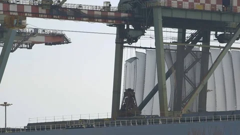 Crane to discharge the cargo ship Stock Footage 71644985