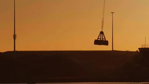 Crane discharging coals during sunset. Stock Footage 111331833