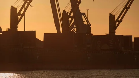 Crane discharging coals during sunset. Stock Footage 111333077