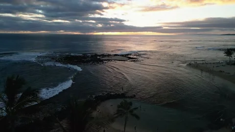 Crane down to reveal the beach at sunset Stock Footage 232426430