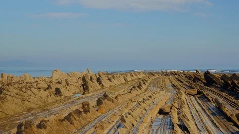 Crane down shot of geological formations at coast Stock Footage 112294546