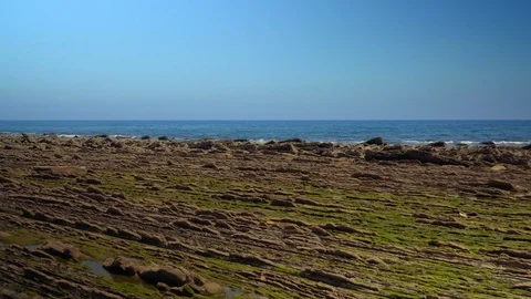 Crane down shot of rocks formations at coast Stock Footage 112294478