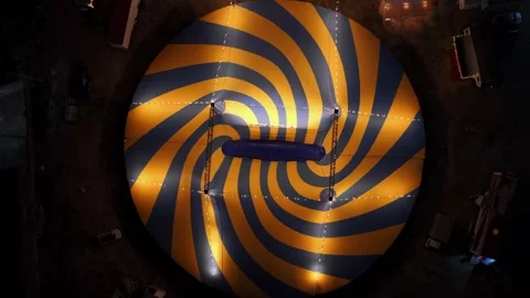 Crane up dutch angle top down night drone shot of circus in Cuernavaca Video stock 328263503