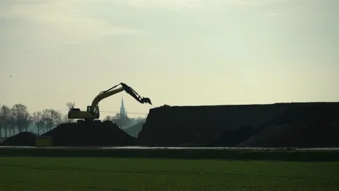 Crane in field with dirt scoops Stock Footage 145156922