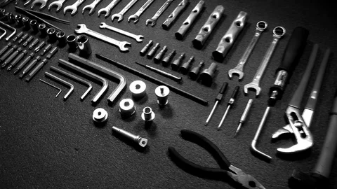 Crane flying over hardware tools laid in order close up video Stock Footage 76102929