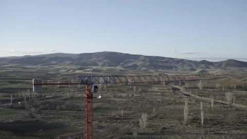 Crane in front of green fields Stock Footage 166458502