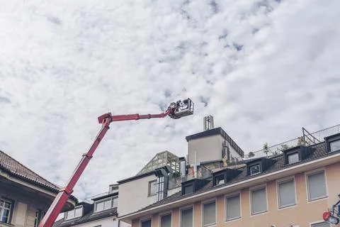 Crane for heavy lifting Working Construction Site in Europe. Stockfoto's