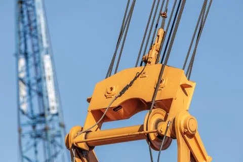 Crane Hook Block With Steel Cables Close-Up On Construction Site Machinery Foto stock