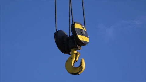 Crane hook on the blue sky. Video stock 143668813