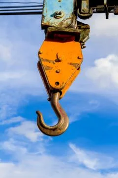 Crane hook on a blue sky Stock Photos