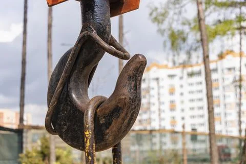 Crane hook for lifting loads. Lifting device for stacking cargo. Stock Photos